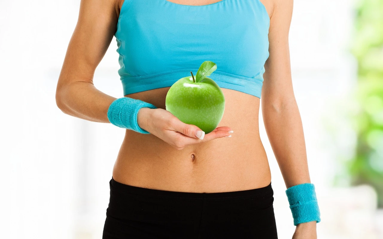 Woman holding a red apple